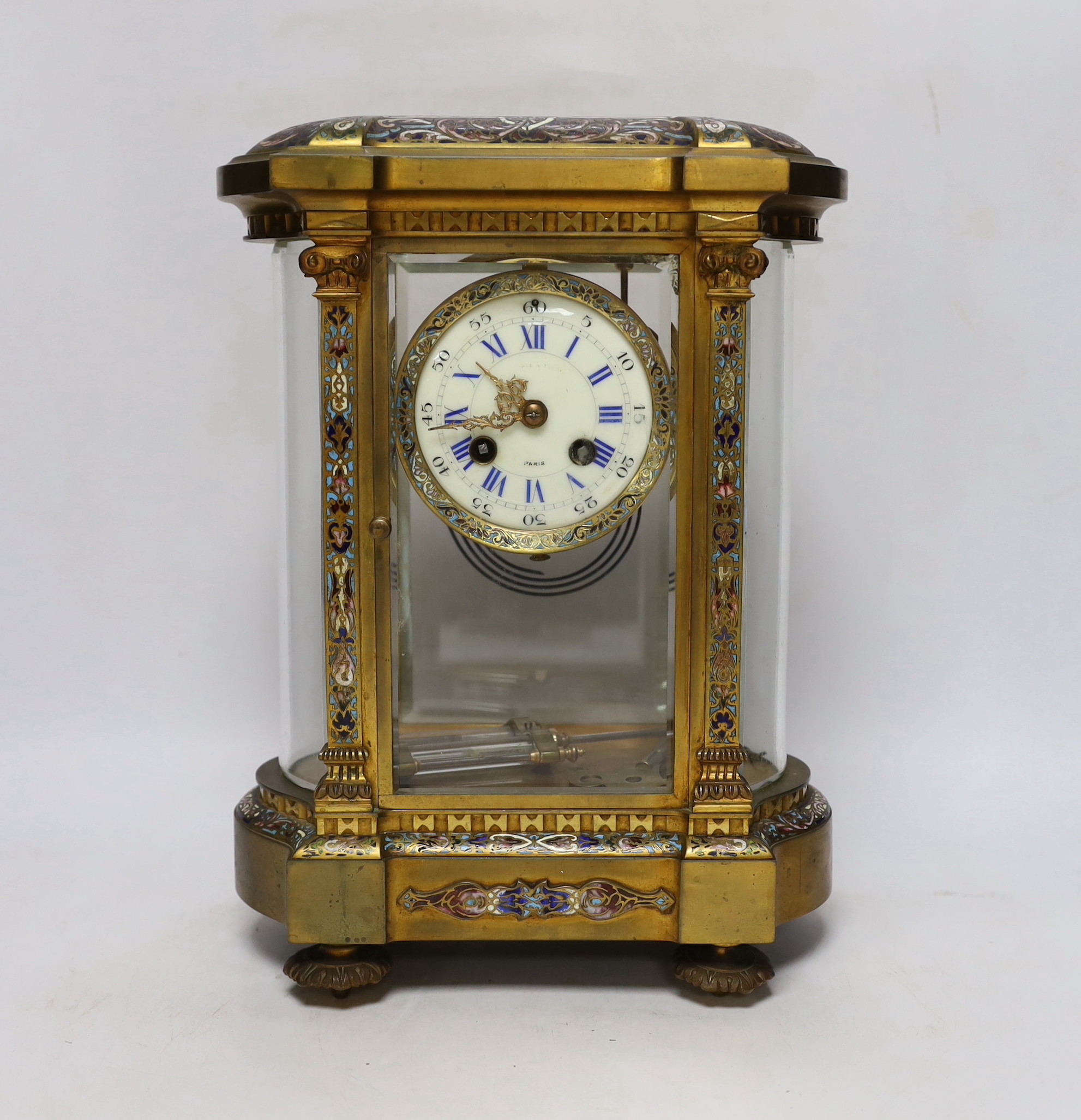 A late 19th century French gilt brass and champleve enamel cased eight day four glass mantel clock, 34cm high
